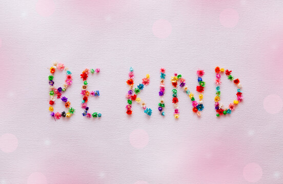 Be Kind - Pink Card With Text And Colorful Little Flowers, Motivation Phrase 