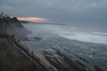 Coast in France near Biarritz with strong waves and fog