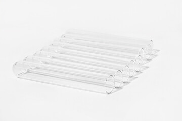 Transparent glass test tubes on a white background, laboratory, medical equipment, glass, chemistry, biochemistry, chemical laboratory, template, for medicine, for drug advertising, tests, medical ana