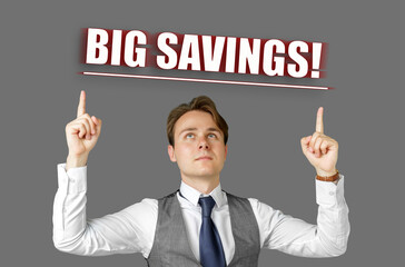 Businessman points fingers at the inscription - BIG SAVINGS