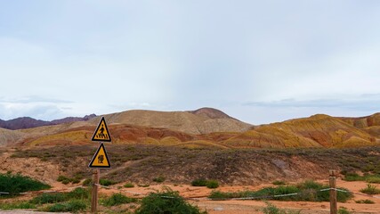 Road sign post captured against the landforms in Zhangye national geopark in Gansu, China