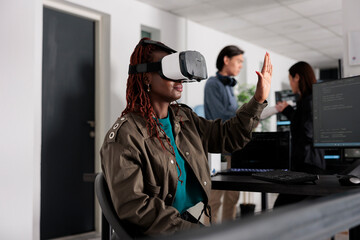 Software developer wearing with vr heaset to create programming server with html script on terminal window. System engineer using virtual reality glasses to plan new interface.