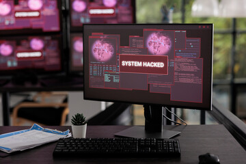 Empty it office having multiple computers flashing hacking alert and security breach, server system being hacked. Pc displays showing critical error message and malware threat warning.