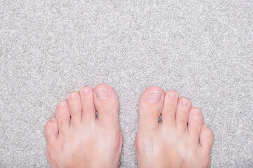 Barefoot woman feet at home on a carpet,casual,home in winter