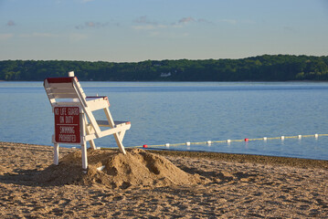 An empty lifeguard chair on a beach in Lloyd Harbor, NY