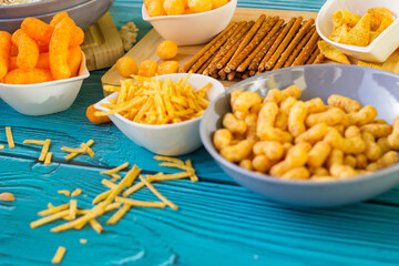 Beer salty snacks on wooden table