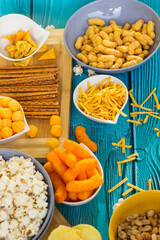 Beer salty snacks on wooden table
