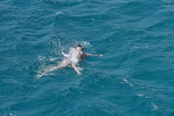 person swimming in the sea