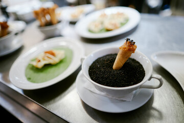 the waiter takes the dishes from the restaurant kitchen