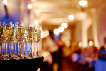 champagne glasses on the background of a night restaurant