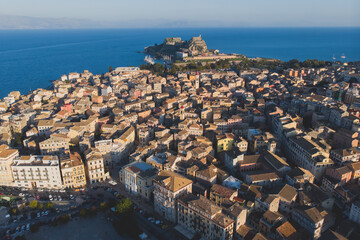 Kerkyra city, Corfu island, Greece, beautiful summer aerial drone view of Kerkyra old town center, with Ionean sea harbour port, Saint Spyridon Church, the Royal Palace and scenery beyond the city