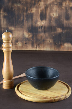 empty clay pot on the wooden table for image mantage use.