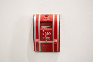 Pull station fire alarm system and mock sprinklers attached to a white wall used for training of...