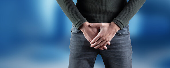 The man covered his groin with his hands