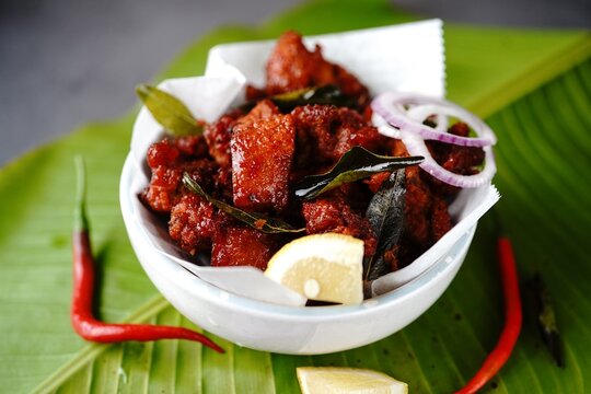 Homemade chicken 65 or chilli chicken fry served in a bowl, selective focus