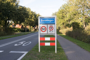 Place name sign for the village of Beuningen, the Netherlands (also speed limit of 50 km per hour,...