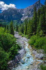 Fototapeta na wymiar Idyllic Alpine landscape with river, Val di Funes, Dolomites alps, Italy