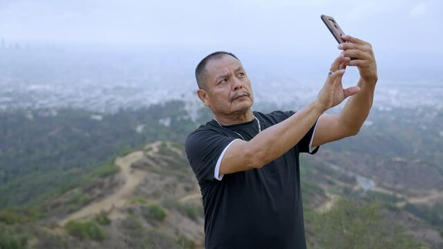 Man Taking A Selfish In The Moutnains 