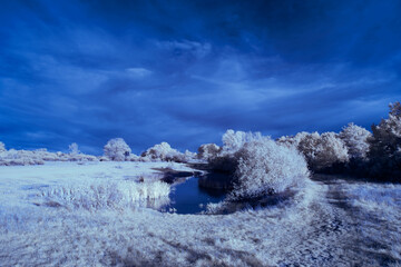 infrared photography - ir photo of landscape under sky with clouds - the art of our world in the infrared spectrum