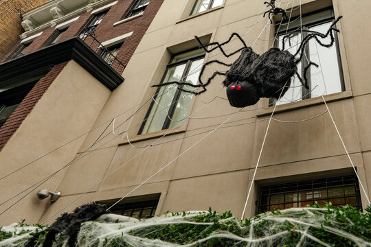 Front of apartment building decorated with spider web for Halloween holiday in Manhattan New York. High-quality photo