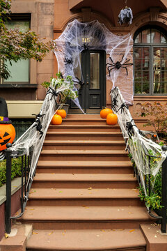 Front of apartment building decorated with spider web for Halloween holiday in Manhattan New York. High-quality photo
