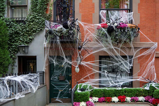 Front of apartment building decorated with spider web for Halloween holiday in Manhattan New York. High-quality photo