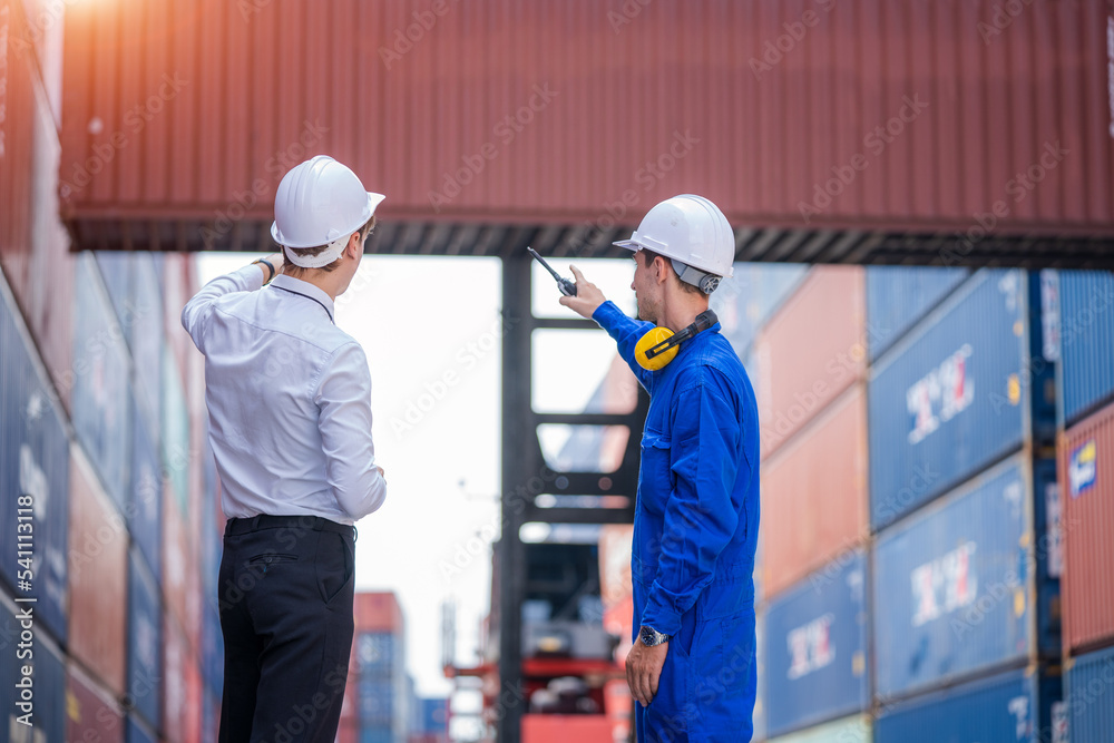 Poster Engineer container cargo with worker working and checking stock into container for loading,logistic and business export.