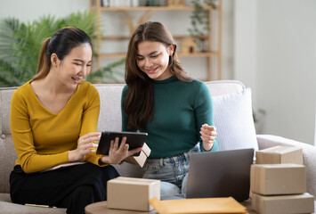 Small start-up business owners checking parcels at work, salespeople, checking production orders. Pack products for delivery to customers Sell ​​Ecommerce Shipping Ideas