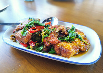 Thai Food Pad Kra Pao. Stir Fried Basil with Fish. Thai restaurant. Thai Cuisine. Thai Street Food.