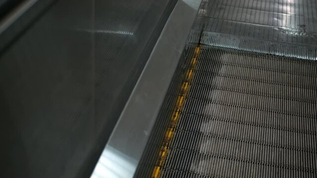 moving walkway, travelator or Trav-O-Lator, version of traditional conveyer belt. flat escalators walkways move passengers through long airport terminals and departure gates.
