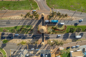 Paulinia, Sao Paulo, Brazil. October 25 2022: Portal of the city of Paulínia in the interior of São Paulo. Cars, city entrance and castle style portal.
