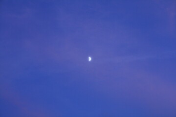 blue sky half moon 