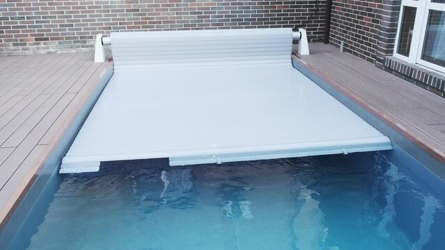 The protective covering for the pool which is rolled on a roller. Unique high-tech PVC lamellas

