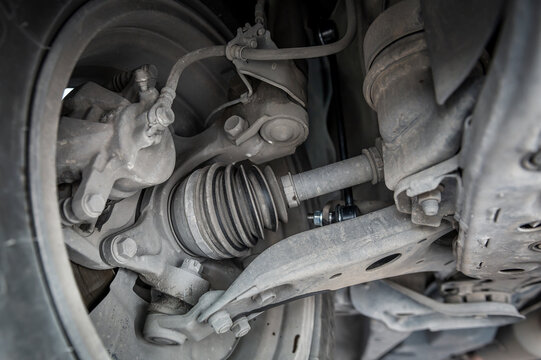 Close-up of automotive CV axle shaft.