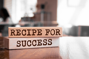 Wooden blocks with words 'Recipe for Success'.