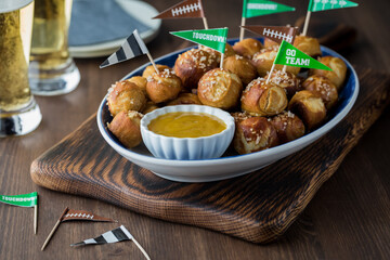 A platter of homemade pretzel bites with beer, ready for a Super Bowl party.