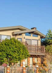 The top of the house or apartment building with nice window.