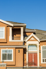 The top of the house or apartment building with nice window.