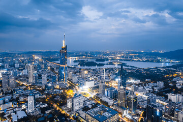 Obraz premium Aerial night view of Zifeng Tower and city skyline in Nanjing, Jiangsu, China