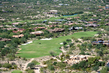 A top-down view of a golf course built in the middle of the Sonoran Desert in Scottsdale Arizona  - obrazy, fototapety, plakaty