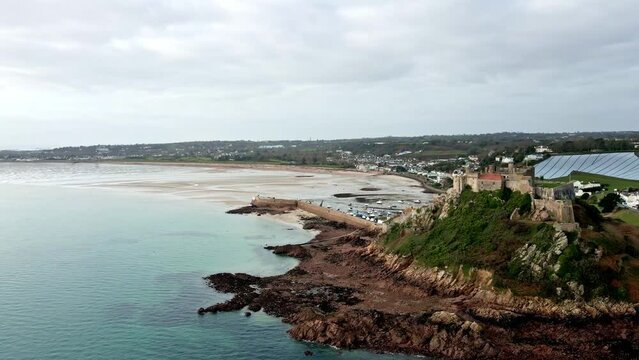 Beautiful aerial drone footage view of Mont Orgueil Castle on the cliff