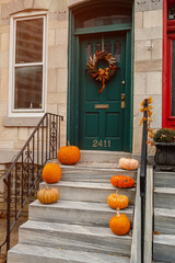 Pumpkin lantern at house front door. Interior ready for trick or treat party or Thanksgiving....