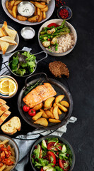 Table of various healthy food dishes. Healthy food assortment. Dieting concept.
