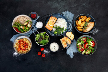 Table of various healthy food dishes. Healthy food assortment. Dieting concept.
