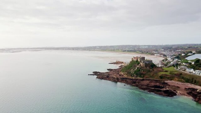 Beautiful aerial drone footage view of Mont Orgueil Castle on the cliff