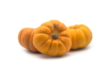 Fototapeta premium closeup of small pumpkins on white background