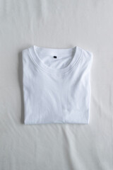 Mockup of top view white blank folded t-shirt template