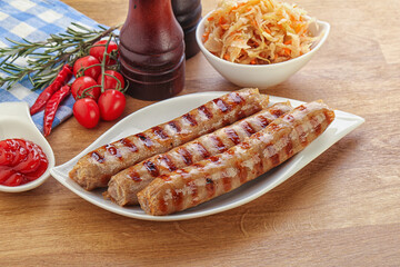 Grilled sausages with cabbage and sauce