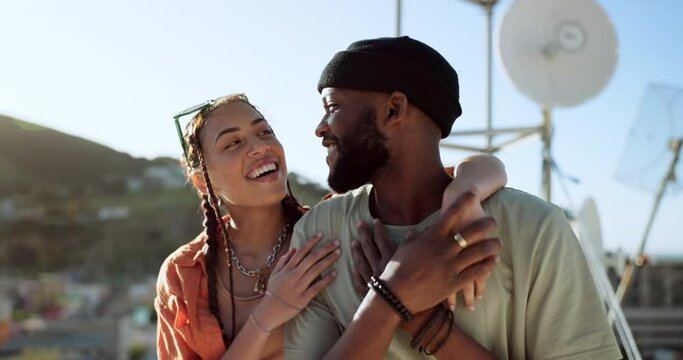 Interracial couple, hug and bonding on city building rooftop for summer holiday, travel vacation date and location break in Boston. Smile, happy black man and talking woman or student fashion friends