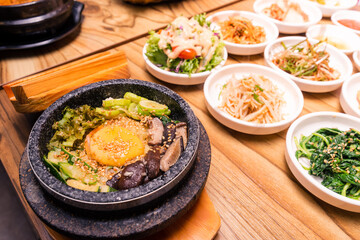 Korean traditional dish- bibimbap mixed rice with vegetables Include beef and fried egg and pickles set